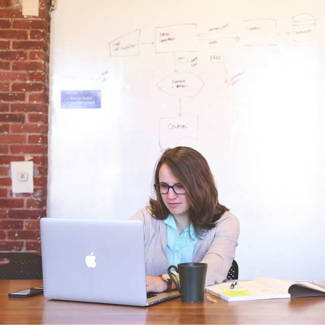 Project coordinator working in front of a white board